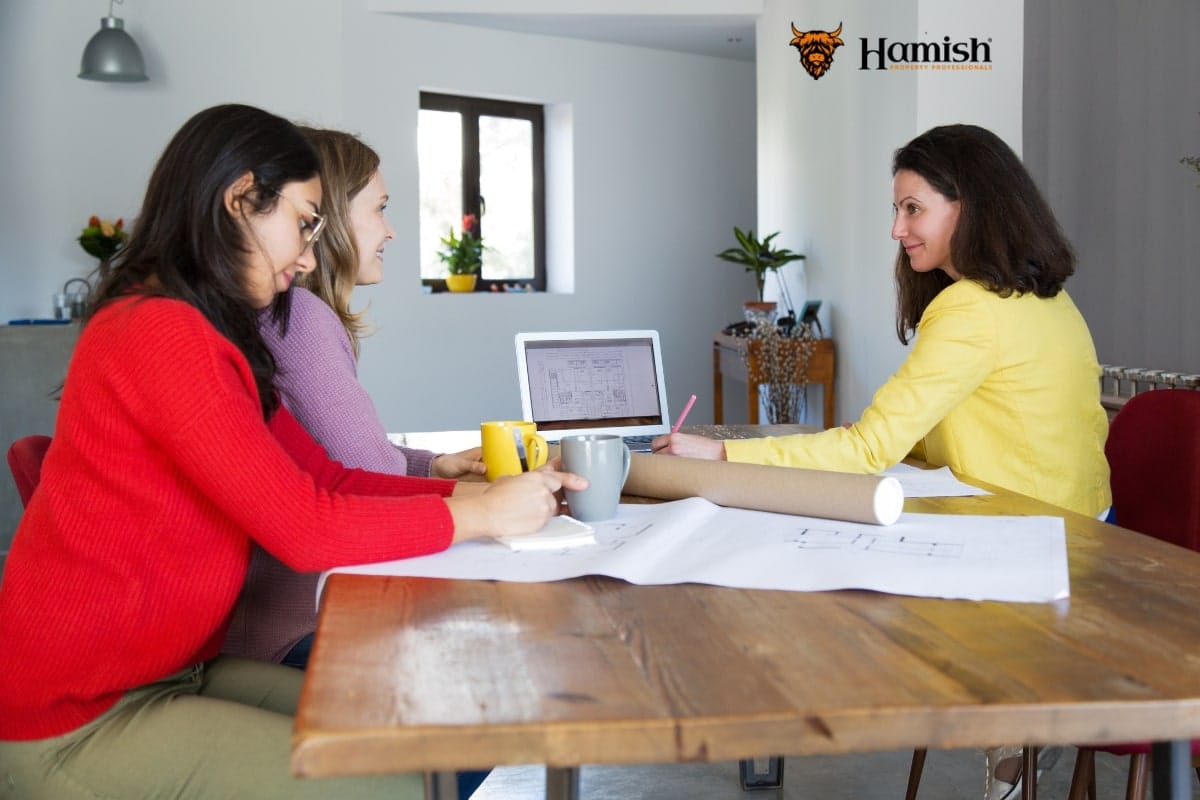 THE COMPLETE GUIDE TO GETTING YOUR HOME VALUED BEHIND THE SCENES AND WHAT TO EXPECT 4 Estate agent presenting marketing plans to homeowners